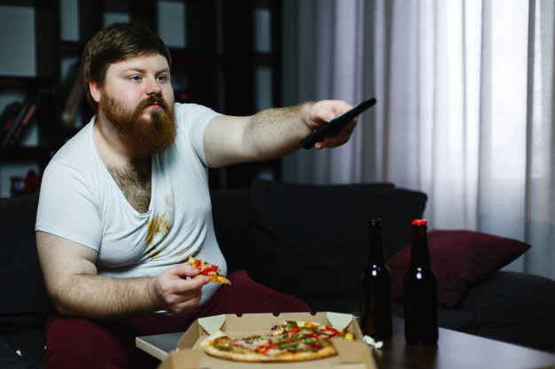 fat-man-eats-pizza-sitting-sofa-switches-channels-tv-set_8353-5504 ...